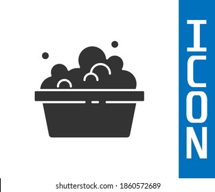 Grey Plastic basin with soap suds icon isolated on white background. Bowl with water. Washing clothes, cleaning equipment.  Vector