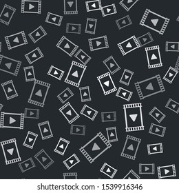 Grey Play Video icon isolated seamless pattern on black background. Film strip with play sign.  Vector Illustration