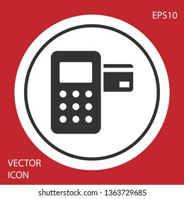 Grey Pos terminal with inserted credit card icon isolated on red background. Payment terminal transaction. Circle button. Vector Illustration