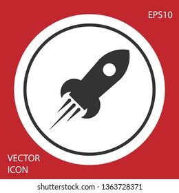 Grey Rocket ship with fire icon isolated on red background. Space travel. Circle button. Vector Illustration