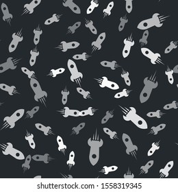 Grey Rocket ship with fire icon isolated seamless pattern on black background. Space travel.  Vector Illustration