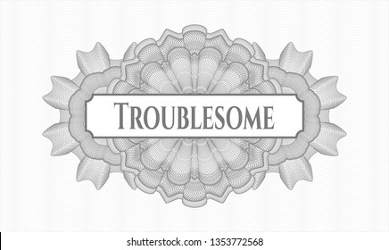 Grey rosette or money style emblem with text Troublesome inside