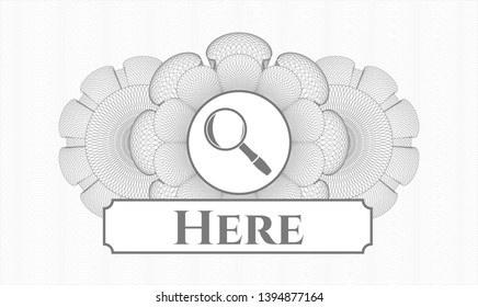 Grey rosette or money style emblem with magnifying glass icon and Here text inside