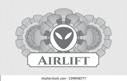 Grey rosette or money style emblem with alien icon and Airlift text inside
