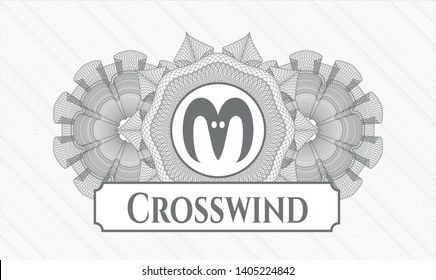 Grey rosette (money style emblem) with goat head icon and Crosswind text inside