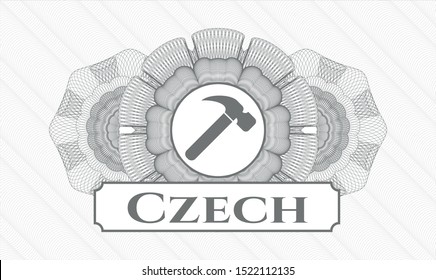 Grey rosette (money style emblem) with hammer icon and Czech text inside