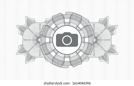Grey rosette or money style emblem with photo camera icon inside