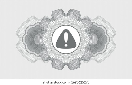 Grey rosette (money style emblem) with warning icon inside