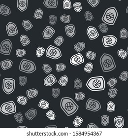 Grey Shield in the basketball ball inside icon isolated seamless pattern on black background.  Vector Illustration
