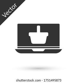 Grey Shopping basket on screen laptop icon isolated on white background. Concept e-commerce, e-business, online business marketing. Vector Illustration