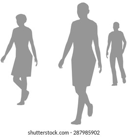 Grey silhouettes of walking people. It can be used to illustrate the rapid rhythm of urban life