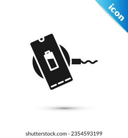 Grey Smartphone charging on wireless charger icon isolated on white background. Charging battery on charging pad.  Vector Illustration