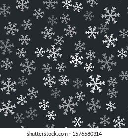 Grey Snowflake icon isolated seamless pattern on black background.  Vector Illustration