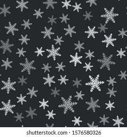 Grey Snowflake icon isolated seamless pattern on black background.  Vector Illustration