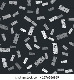 Grey Sponge with bubbles icon isolated seamless pattern on black background. Wisp of bast for washing dishes. Cleaning service logo.  Vector Illustration