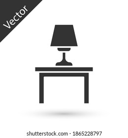 Lámpara de mesa gris en el icono de la mesa aislado en el fondo blanco.  Vector