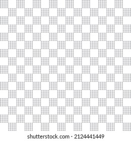 Grey tartan on white background. Grey gingham checker pattern. Vertical and horizontal crossing lines on white background.