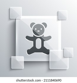 Icono de juguete de peluche de oso gris aislado en fondo gris. Paneles de vidrio cuadrado. Vector