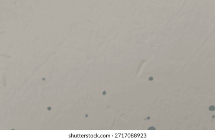 Un fondo de textura gris con puntos azules dispersos, creando un diseño sutil y moderno que equilibra simplicidad y creatividad.