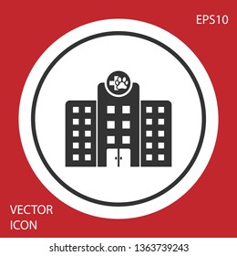 Grey Veterinary medicine hospital, clinic or pet shop for animals icon isolated on red background. Vet or veterinarian clinic. White circle button. Vector Illustration