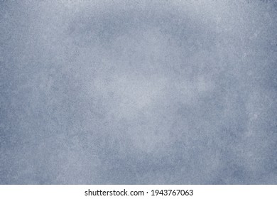 Grey wall in spots, cracks, stains. Painted concrete wall in abstract grunge style. Grunge background texture for backgrounds, portraits, posters.