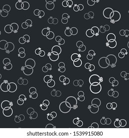 Grey Wedding rings icon isolated seamless pattern on black background. Bride and groom jewelery sign. Marriage icon. Diamond ring.  Vector Illustration