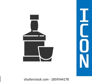 Grey Whiskey bottle and glass icon isolated on white background.  Vector