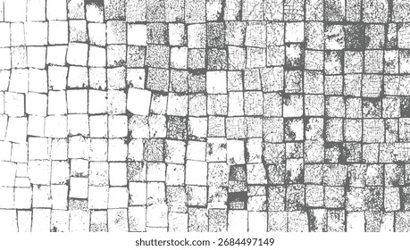 grey and white textured background of cracked stone pavement blocks arranged in a grid pattern.