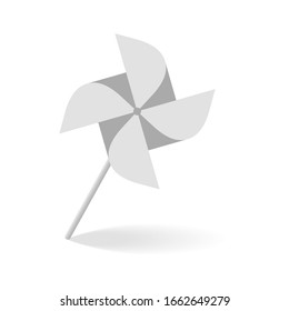 Grey windmill icon with shadow.