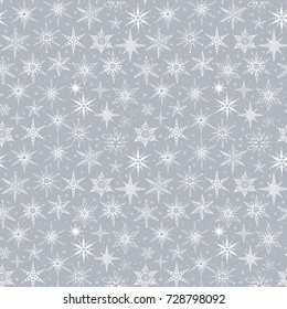 Grey winter seamless background with snowflakes.