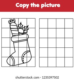 Grid copy game. Complete the picture. Printable kids activity sheet with Christmas sock. Winter holidays theme