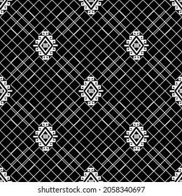 Grid seamless pattern. Textured ornamental black and white background. Repeat tribal ethnic traditional style backdrop. Lattice ornament with lines, greek key, meanders, rhombus. Elegant simple design