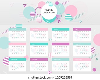 Grid style layout of 2019 yearly calendar with colorful abstract elements.