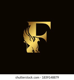 Griffin silhouette inside gold letter F. Heraldic symbol beast ancient mythology or fantasy. Creative design elements for logotype, emblem, monogram, icon or symbol for company, corporate, brand name.