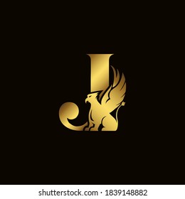 Griffin silhouette inside gold letter J. Heraldic symbol beast ancient mythology or fantasy. Creative design elements for logotype, emblem, monogram, icon or symbol for company, corporate, brand name.