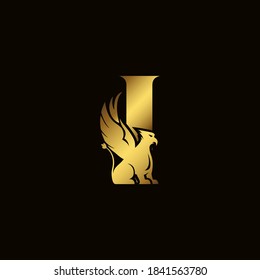 Griffin silhouette inside gold letter I. Heraldic symbol beast ancient mythology or fantasy. Creative design elements for logotype, emblem, monogram, icon or symbol for company, corporate, brand name.