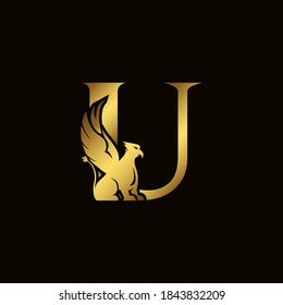 Griffin silhouette inside gold letter U. Heraldic symbol beast ancient mythology or fantasy. Creative design elements for logotype, emblem, monogram, icon or symbol for company, corporate, brand name.