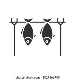 Grilled fish glyph icon. Drying fish. Silhouette symbol. Negative space. Vector isolated illustration