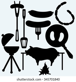 Grilled sausage on fork and on frying pan, set of bbq objects, and roasted pig. Isolated on blue background. Vector silhouettes