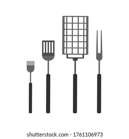 grilling set: a grill grate, fork, silicone basting brush and turner; grill party on a backyard concept