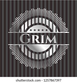 Grim silver emblem or badge