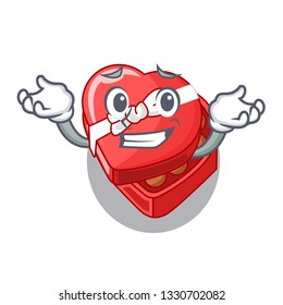 Grinning choclate heart box in shape mascot