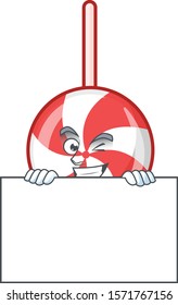 Grinning striped peppermint candy cartoon character style hides behind a board