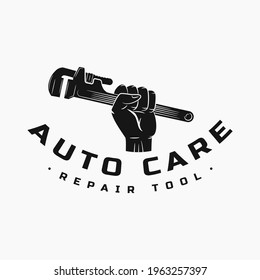 gripping the spanner and wrench. logo icon and vector