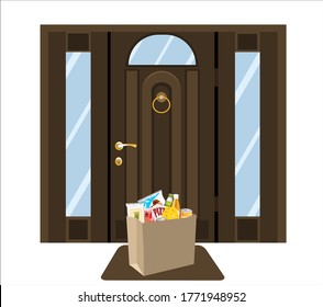 Groceries in package before  front door. Safe contactless delivery to home to prevent the spread of the corona virus.