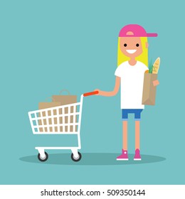 Grocery shopping concept: Young customer standing with a trolley and holding a shopping bag / flat editable vector illustration
