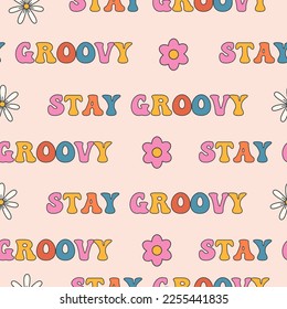 Groovy patrón sin fisuras con flores y la frase groovy para diseño e impresión. Elementos de los años 70, 80, 90.