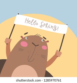 Groundhog looking out from his burrow and holding a sign with the text "Hello spring!". Vector illustration on a blue background. Groundhog Day illustration. 