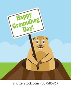 Groundhog peeps out from burrows and holds in paws plate with congratulations