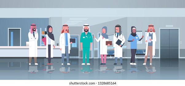 group of arabic doctors team treatment communication concept arab medical hospital mix race workers standing together modern clinic hall interior full length horizontal